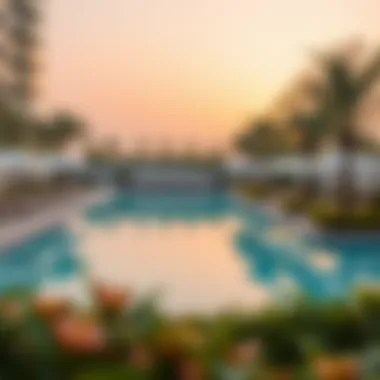 Luxurious Poolside Experience Luxurious swimming pool at Beach Rotana Residence surrounded by greenery