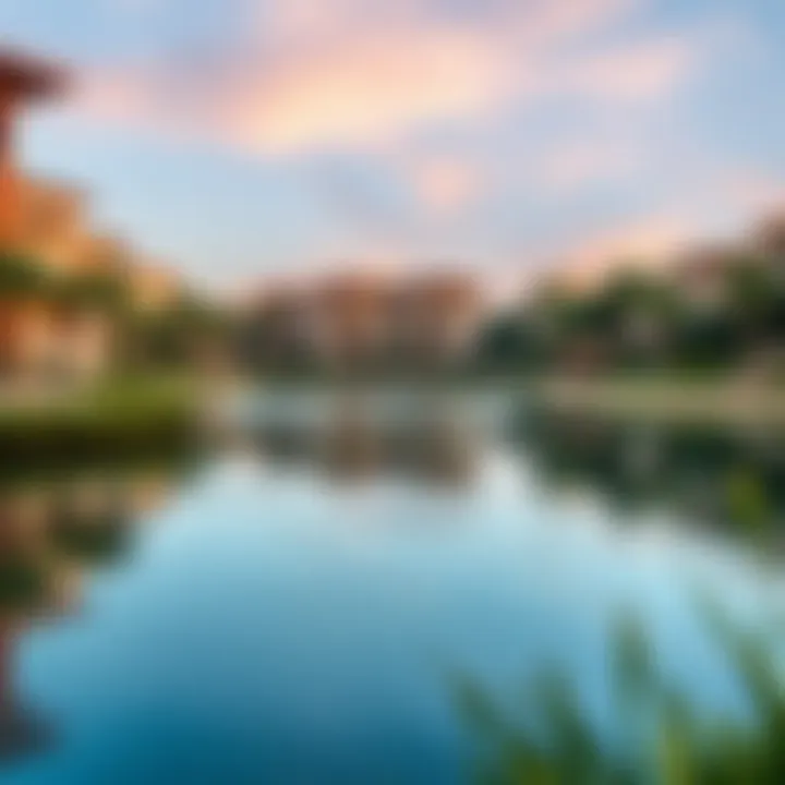 A serene lake surrounded by residential buildings, highlighting the integration of nature in Tilal Al Ghaf.